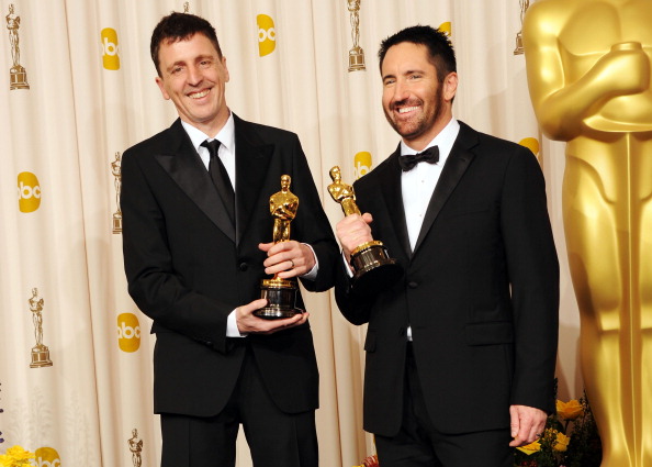 HOLLYWOOD, CA - FEBRUARY 27: Composers Atticus Ross (L) and Trent Reznor, winners of the award for Best Original Score for 'The Social Network', pose in the press room during the 83rd Annual Academy Awards held at the Kodak Theatre on February 27, 2011 in Hollywood, California. (Photo by Jason Merritt/Getty Images)